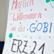 An einer Tafel steht Herzlich Willkommen an der GOBI